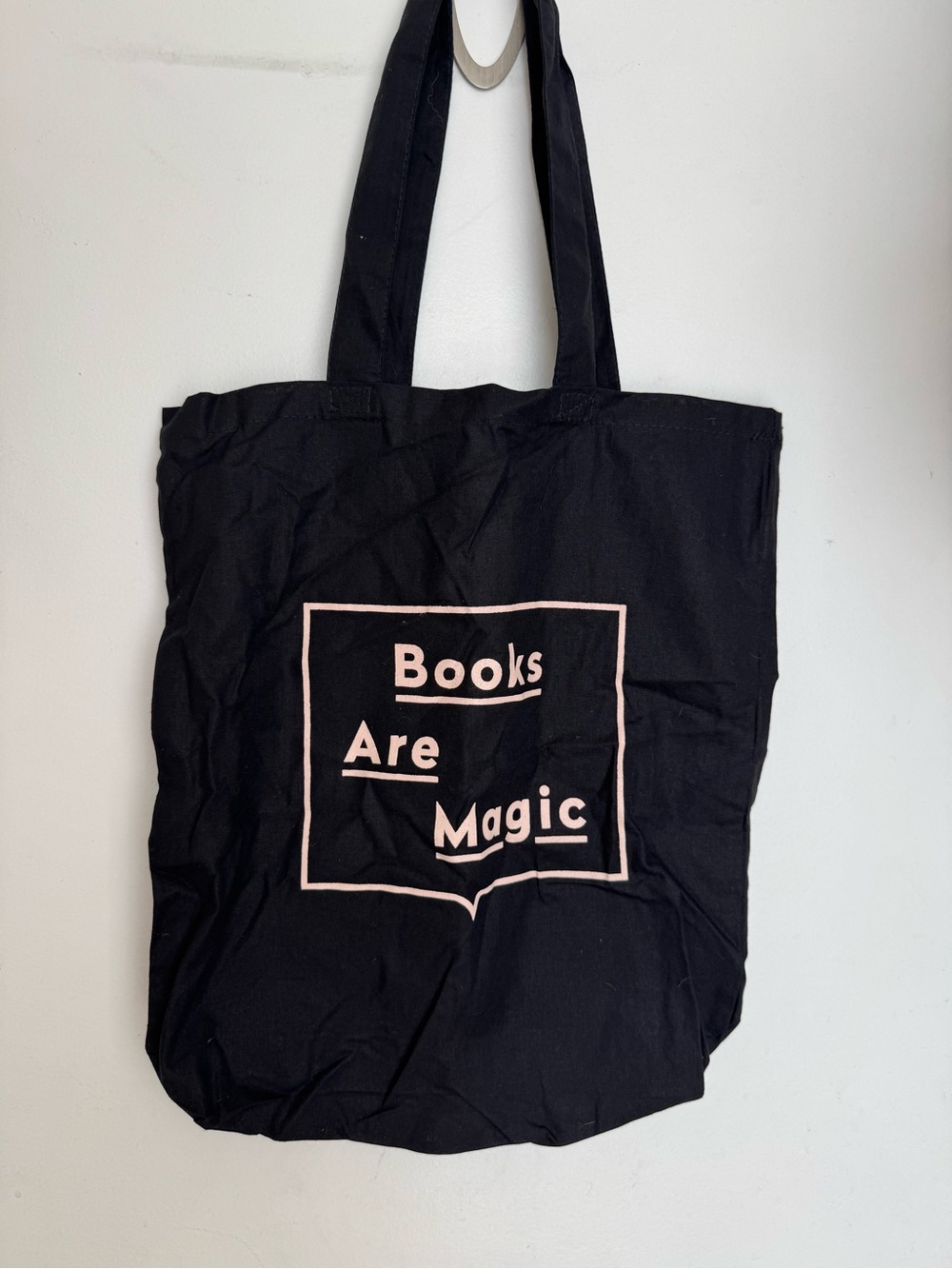 Books Are Magic Black Tote Bag with Pink Print